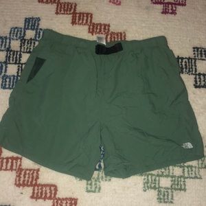 Green north face shorts with an adjustable belt